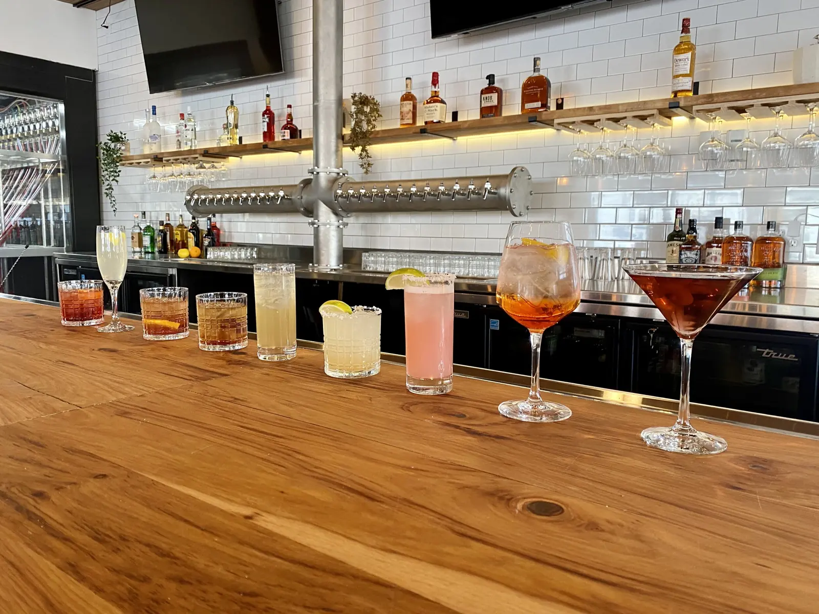 Craft cocktails lined up on the bar